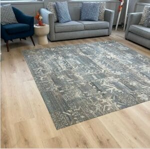 Medical waiting room with light wood-look luxury vinyl tile flooring and patterned carpet tile.